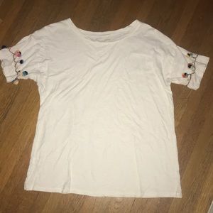 White tee with multicolored Pom Pom details